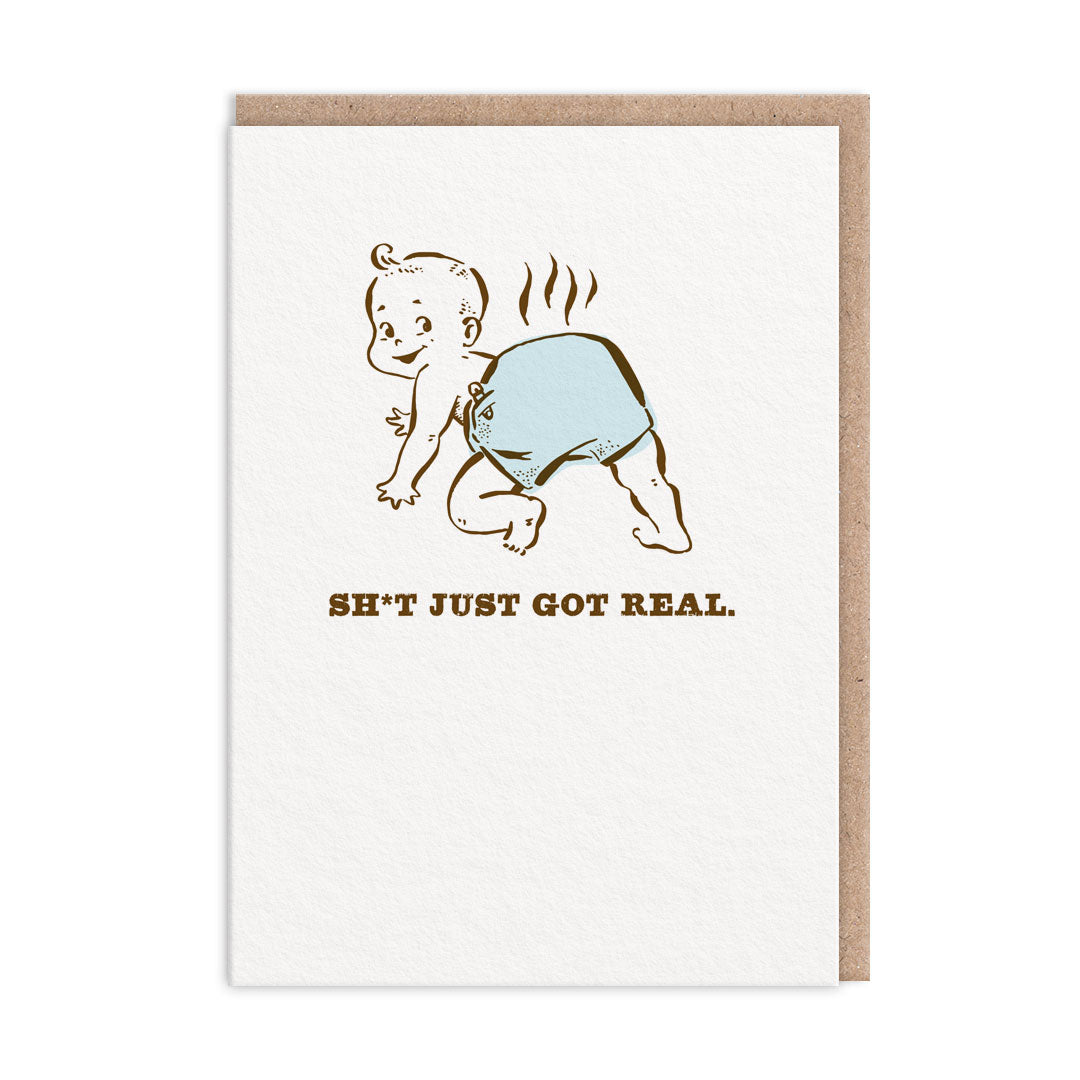 New Baby Card with an illustration of a smiling baby with a full and steaming nappy. Text reads "Sh*t Just Got Real"