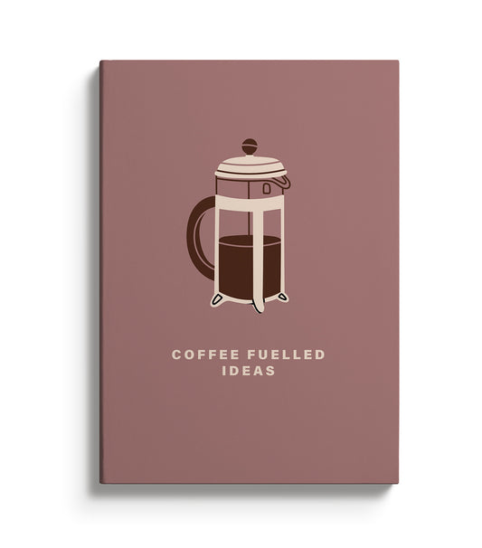 Brown notebook featuring a cafetière  illustration and text reading Coffee Fuelled Ideas