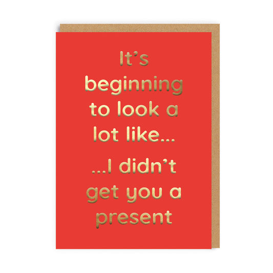 Funny Red Christmas Card with gold foil letters reading "It's beginning to look a lot like......I didn't get you a present"