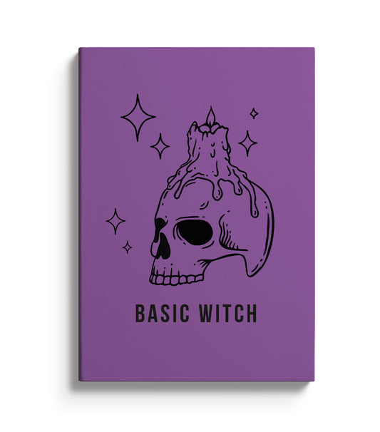 Purple Notebook with skull and candle illustration with the text Basic Witch